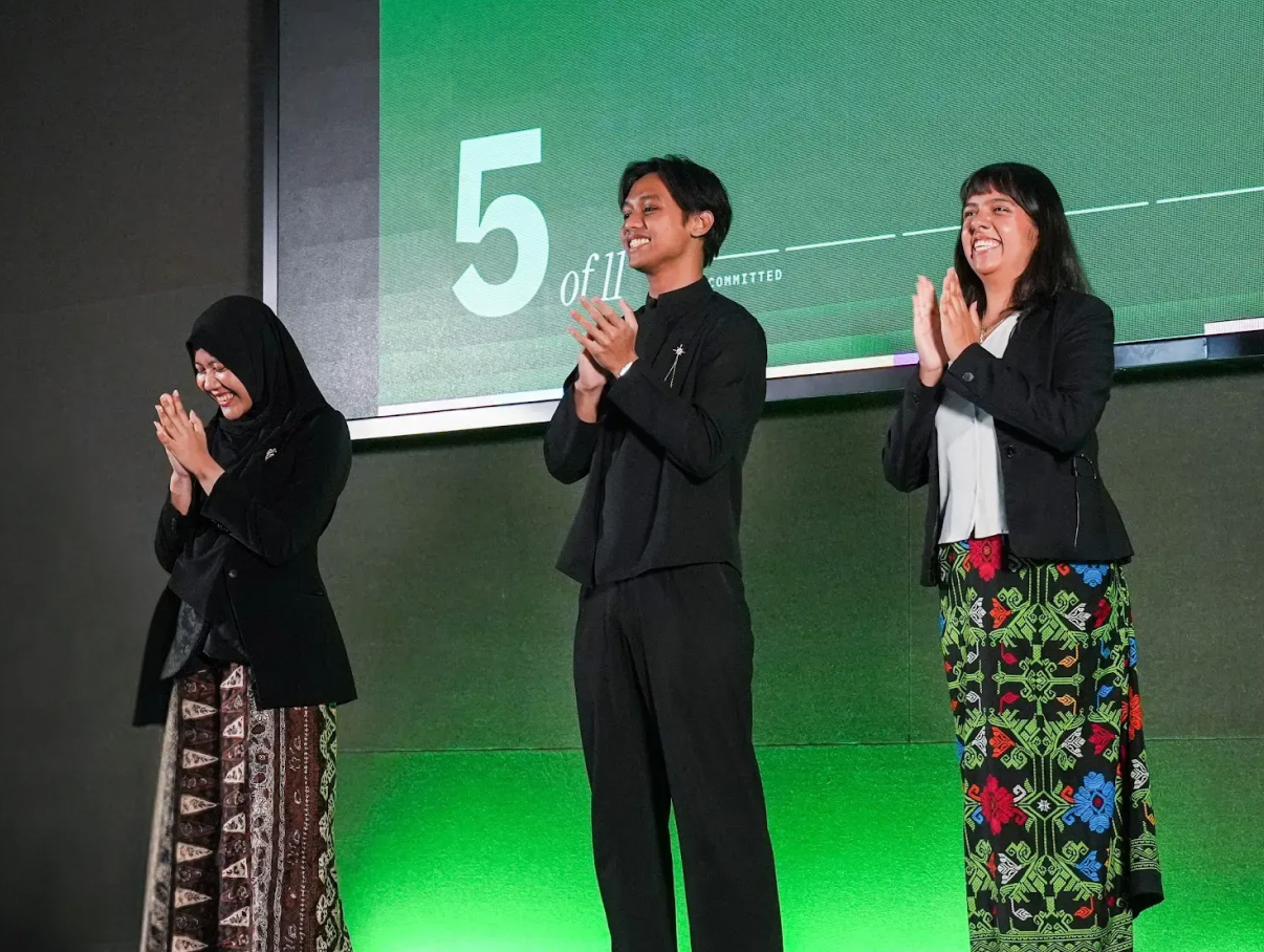 FounderCamp participants on stage celebrating progress during program day 4