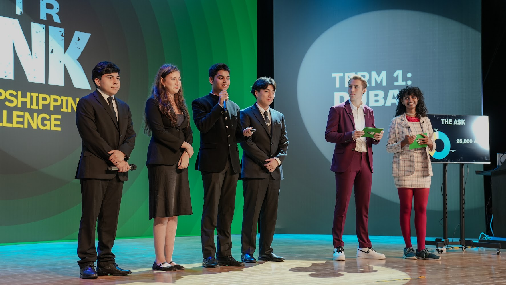 FounderCamp participants pitching on stage during program day 6
